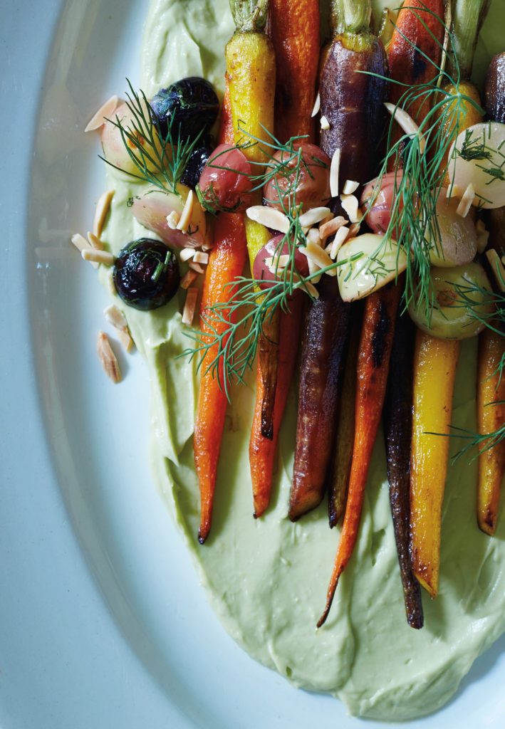 Pan-roasted carrots with salt-roasted grapes and carrot-top green goddess dressing