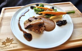 Cooks the Books: Grilled Denver Steak “Bakareta” with tomato liver sauce, California Walnut crusted rice cake and glazed California Prunes.