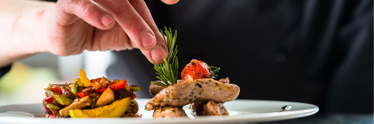 A Taste Canada chef putting the finishing touches on a plate