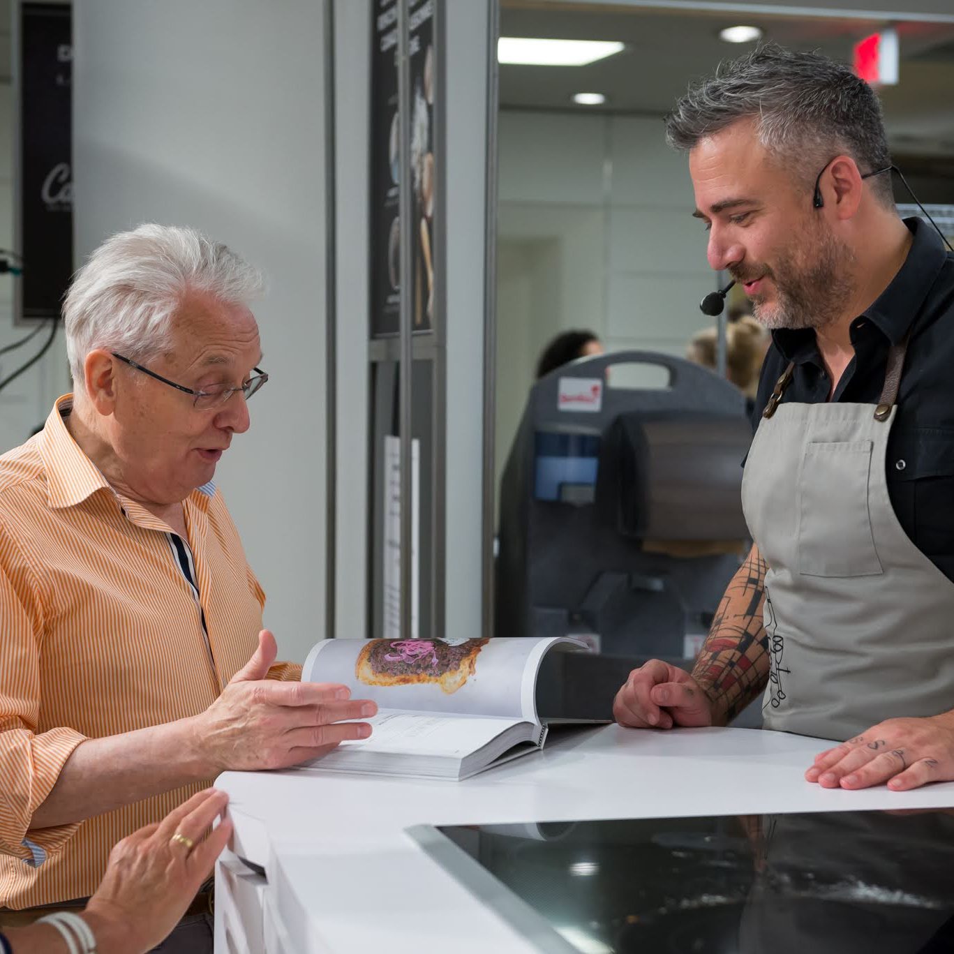 A cookbook author signing a book