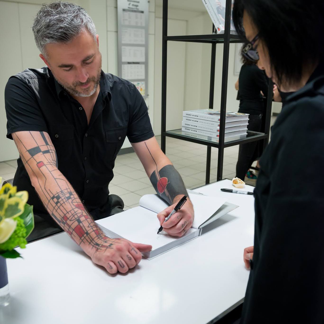 An author signing a cookbook